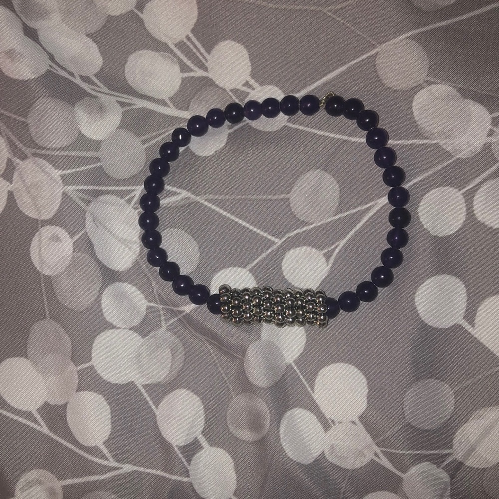 A purple beaded bracelet